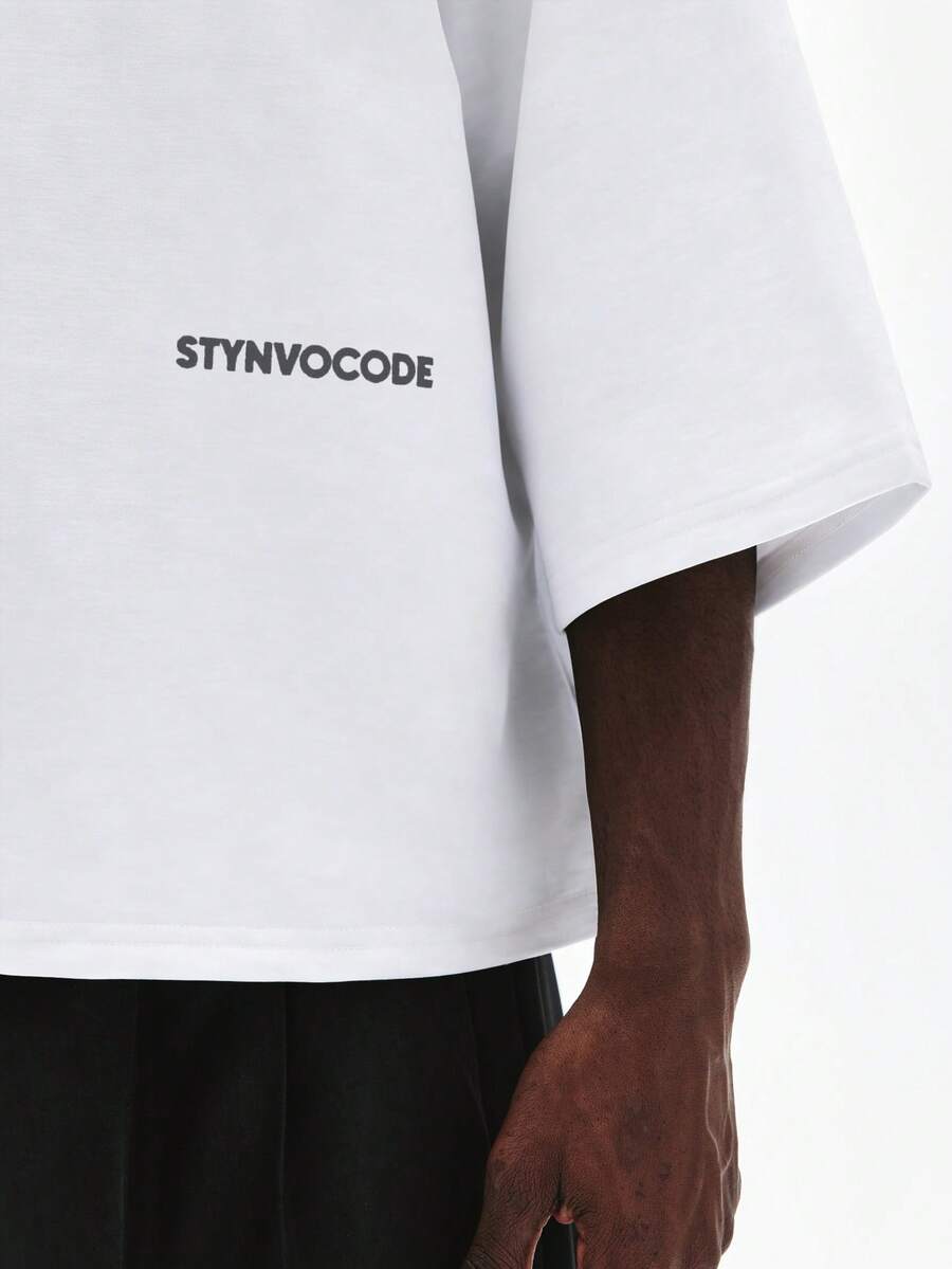 Camiseta suelta de hombro caído con estampado de letras casual para hombre