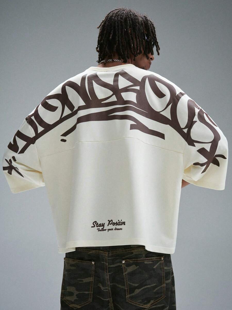 Camiseta suelta de hombro caído con estampado de letras casual para hombre
