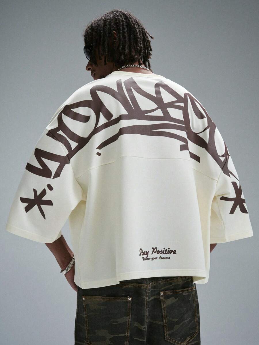 Camiseta suelta de hombro caído con estampado de letras casual para hombre