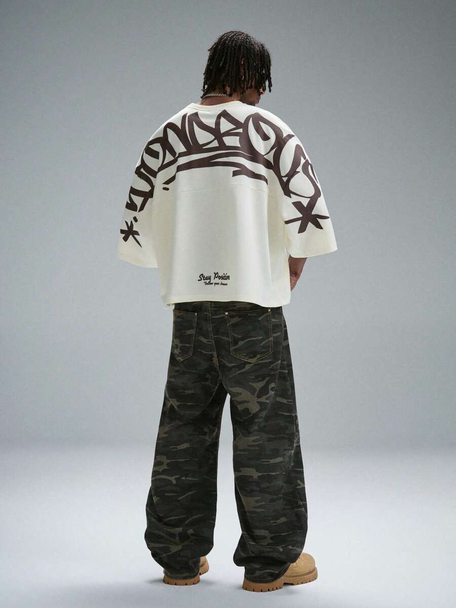 Camiseta suelta de hombro caído con estampado de letras casual para hombre